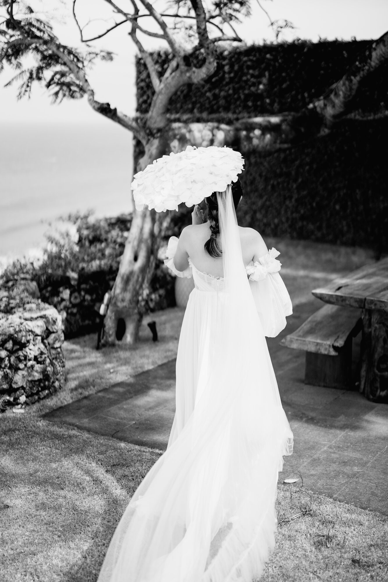 Black and white portrait of a bride with a parasol